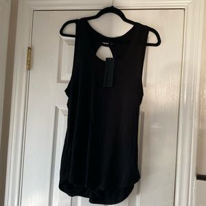 Mono B black tank top with peak a boo back. Size large. Cute for layering